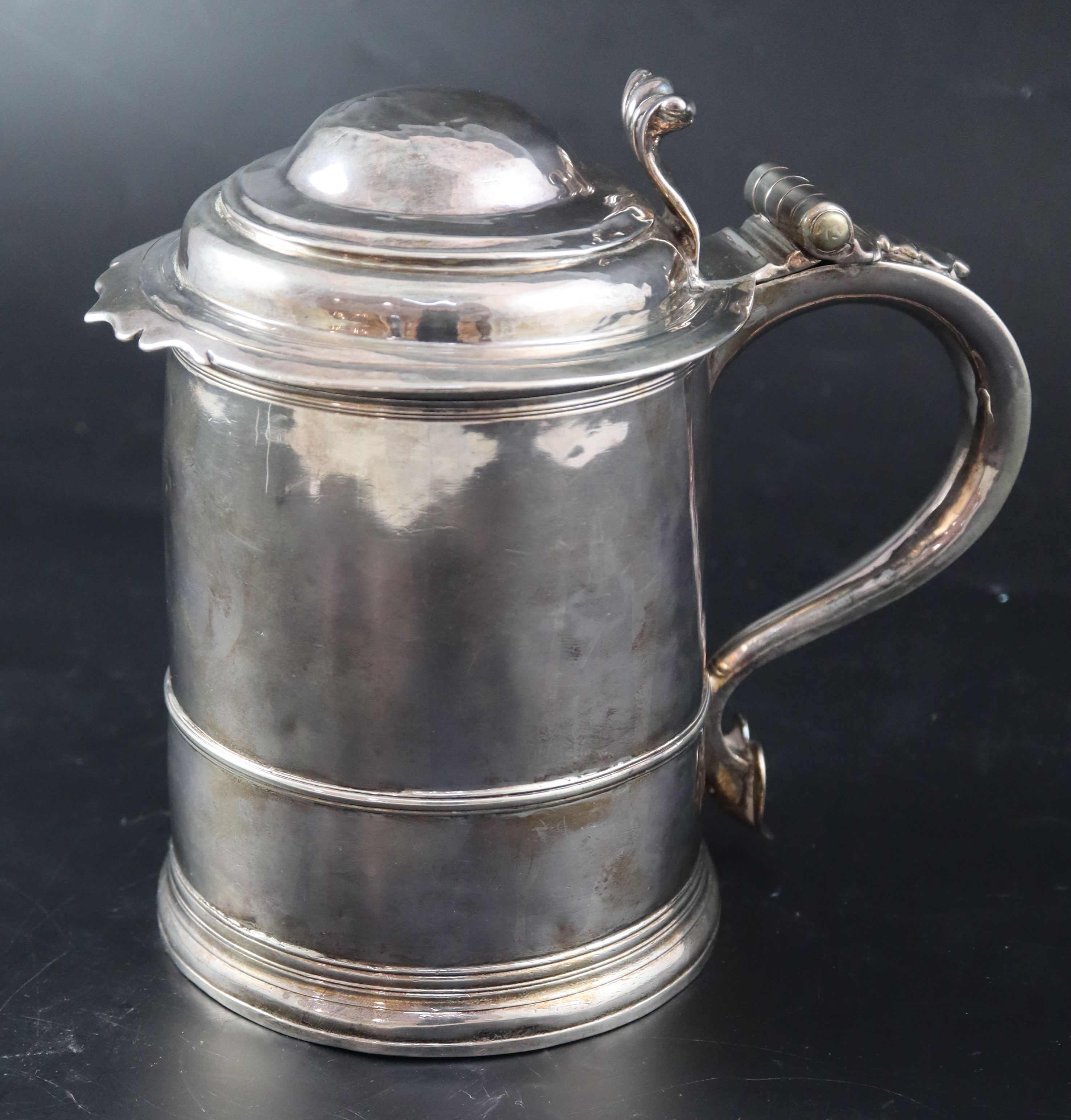 A late Queen Anne silver tankard, 17.4cm, 21.5oz (a.f.).